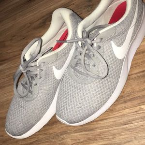Gray and White Nike shoes